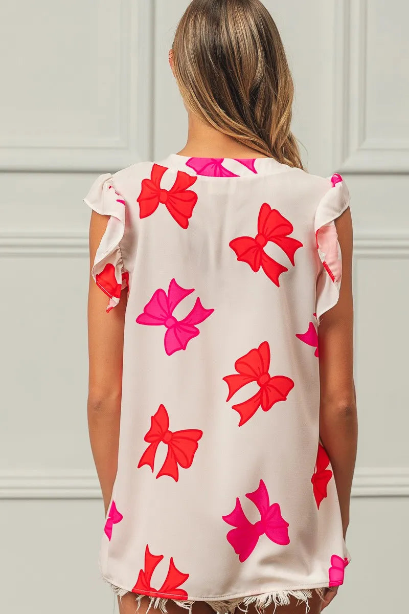 Bow Printed Woven Ruffled Sleeves V Neck Top at In Style Chics Boutique