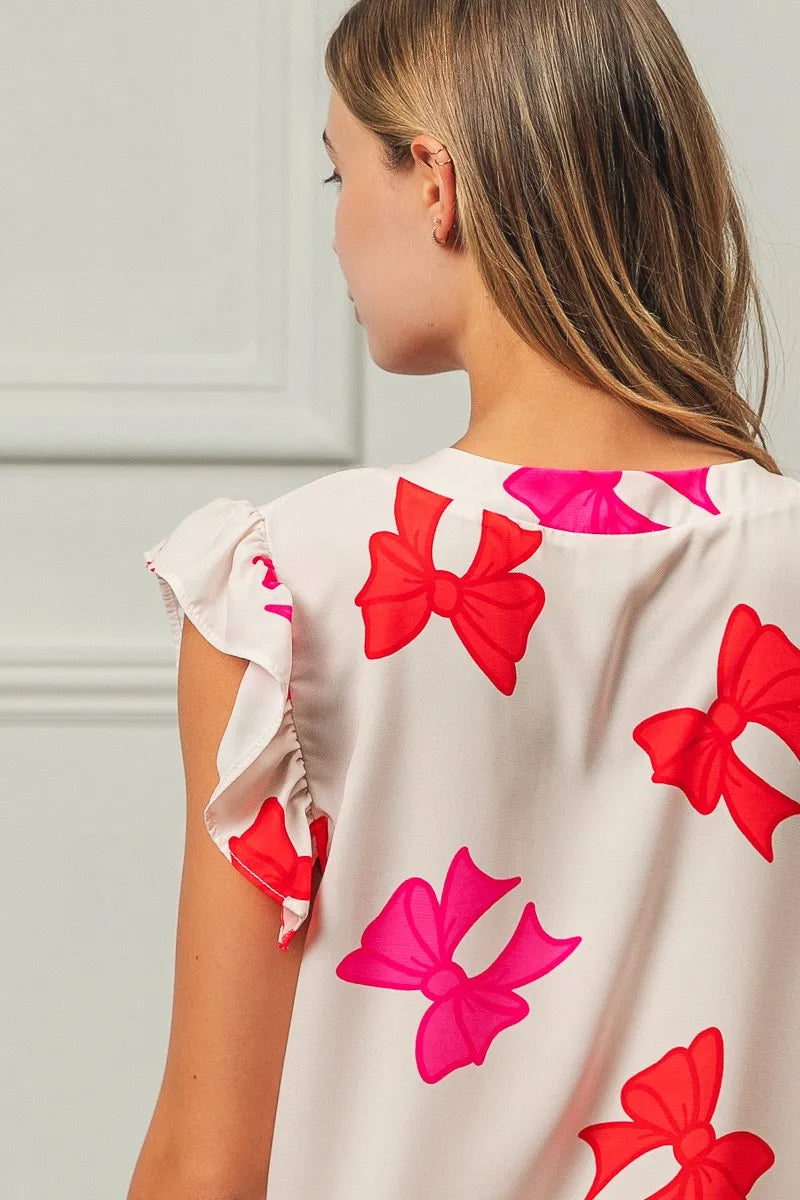 Bow Printed Woven Ruffled Sleeves V Neck Top at In Style Chics Boutique